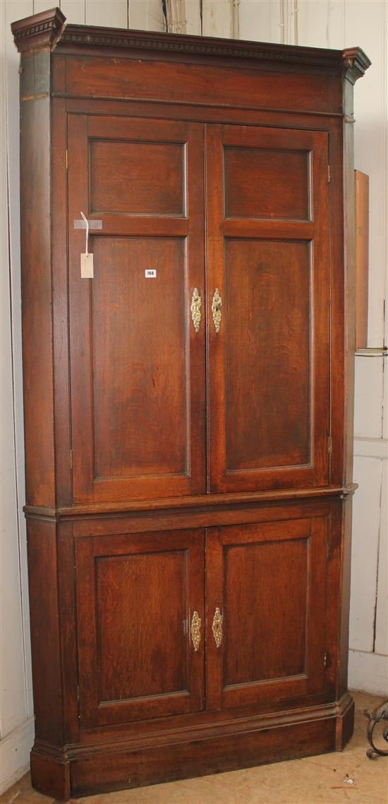 Georgian oak standing corner cupboard, with dentil cornice(-)